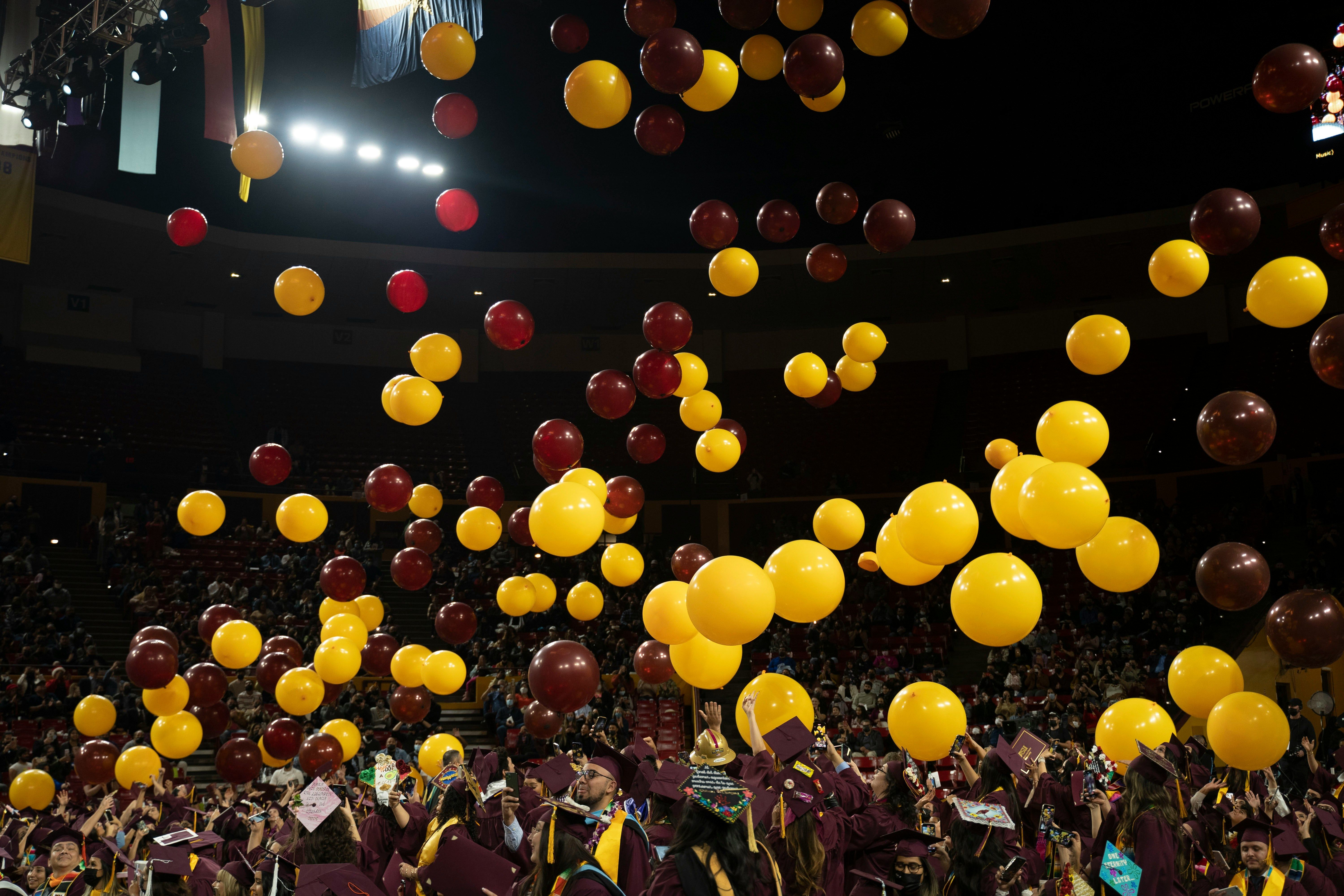ASU graduation with lots of maroon and gold balloons.